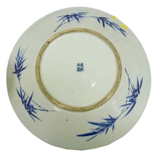 507A - A Chinese export ware blue and white porcelain charger, 19th century, hand painted with central stra... 