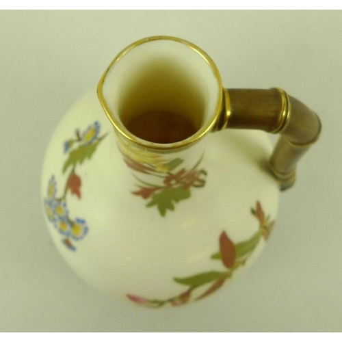 550 - A Victorian Royal Worcester blush ivory jug in the Aesthetic style, with gilded handle, decorated wi... 