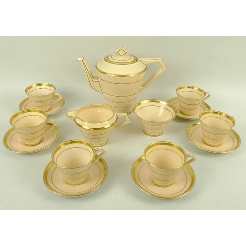 551 - An Art Deco 1930's Paragon part coffee set, decorated in peach and gold, comprising a coffee pot, 21... 