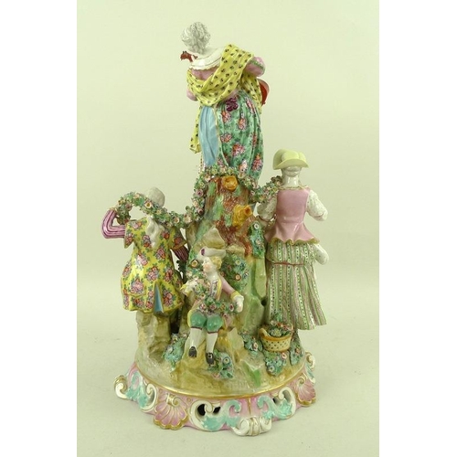 566 - A 19th century porcelain centrepiece figural group, comprising five figures amongst rocks, with a wo... 