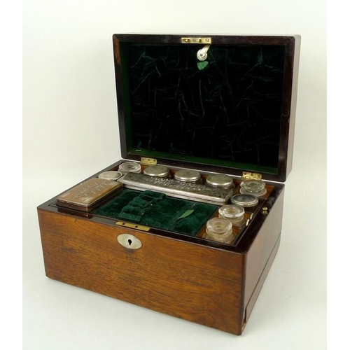 707 - A 19th century oak vanity case, fully fitted interior to include nine glass bottles with covers, a f... 