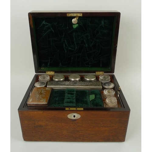 707 - A 19th century oak vanity case, fully fitted interior to include nine glass bottles with covers, a f... 