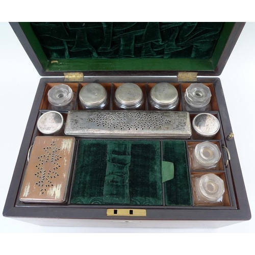 707 - A 19th century oak vanity case, fully fitted interior to include nine glass bottles with covers, a f... 