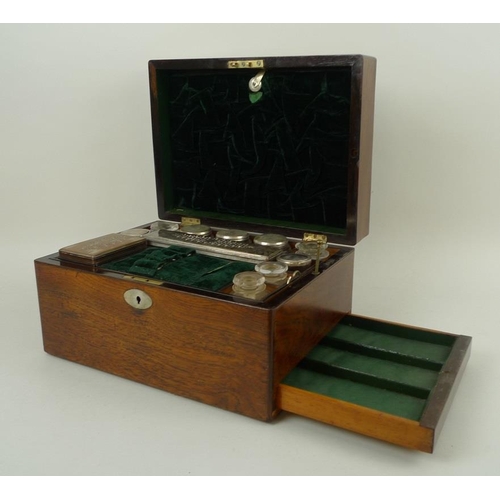 707 - A 19th century oak vanity case, fully fitted interior to include nine glass bottles with covers, a f... 