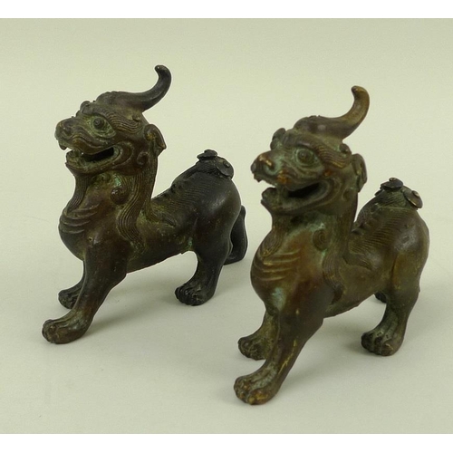 708 - A pair of bronze figures, modelled as Dogs of Fo standing with jaws open, 12 by 10cm. (2)