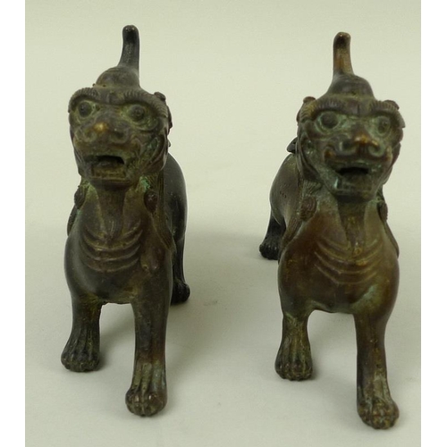 708 - A pair of bronze figures, modelled as Dogs of Fo standing with jaws open, 12 by 10cm. (2)