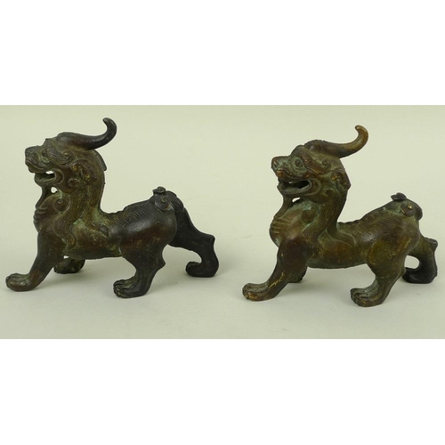 708 - A pair of bronze figures, modelled as Dogs of Fo standing with jaws open, 12 by 10cm. (2)