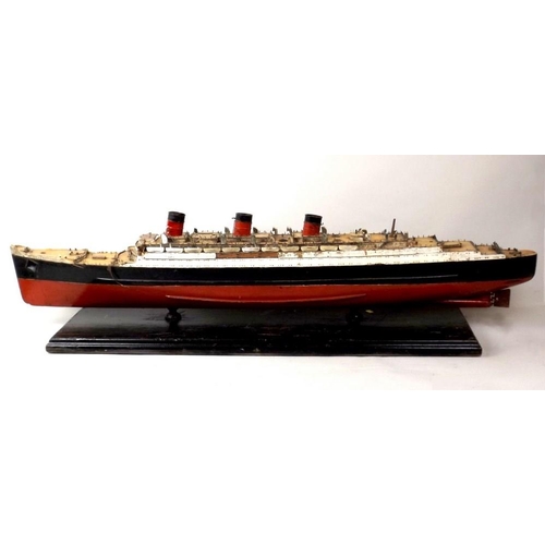 719 - A painted wooden model of the Queen Mary, mid 20th century, with burgundy and black hull, on a woode... 