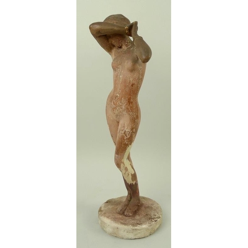 728 - A plaster figure of a nude woman, mid 20th century, modelled standing with hands clasped together an... 