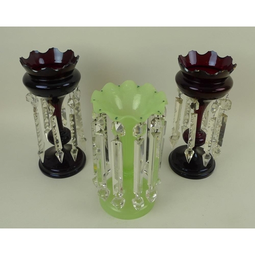 730 - A vaseline green glass lustre, 25.5cm, together with a pair of ruby glass lustres, 28cm, one a/f cra... 