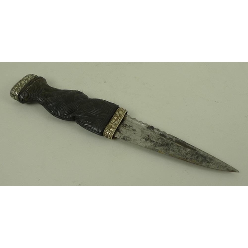 731 - An early 20th century dirk, with a carved rosewood handle and white metal mounts, blade 9cm, 17.5cm ... 