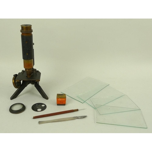 732 - An early 20th century microscope with brass body and an iron base, 26cm, together with four glass sl... 