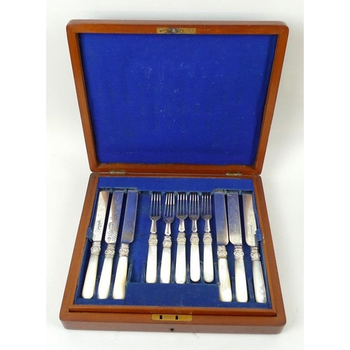 733 - A mahogany cased set of dessert knives and forks, silver plated with mother of pearl handles, 11 for... 