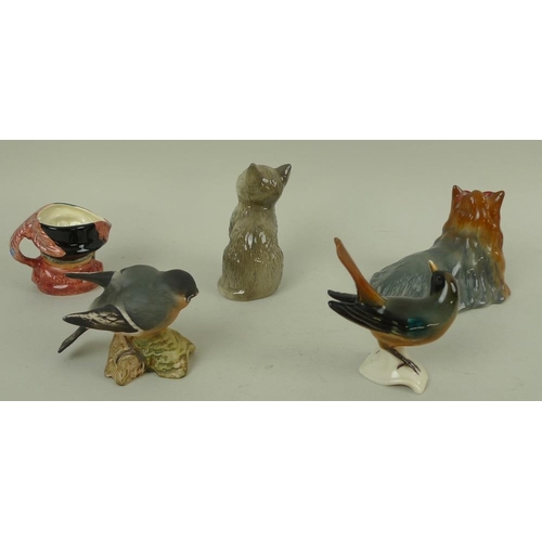 736 - A group of ceramic figurines, 20th century, comprising a Royal Doulton grey seated cat, 10cm, a mini... 