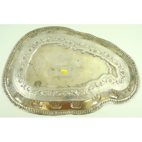 744 - An unmarked Ceylon silver metal tray, in the shape of Sri Lanka, impressed to the border with sevent... 