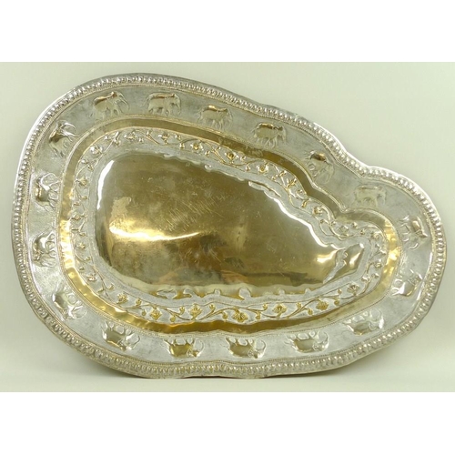 744 - An unmarked Ceylon silver metal tray, in the shape of Sri Lanka, impressed to the border with sevent... 