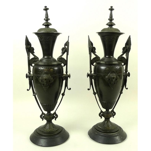 745 - A pair of Art Deco bronze vases and covers, of stylised urn form, decorated in the Egyptian Revival ... 