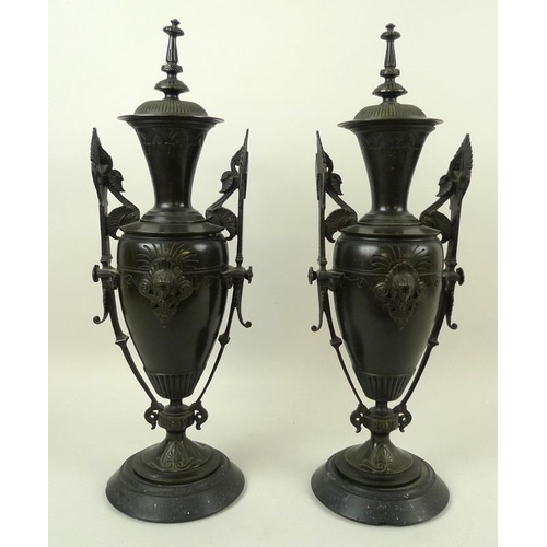 745 - A pair of Art Deco bronze vases and covers, of stylised urn form, decorated in the Egyptian Revival ... 