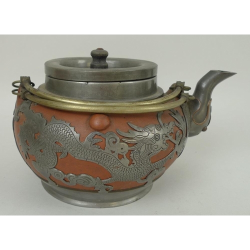 747 - A Chinese pottery and silver metal mounted teapot, early 20th century, with two brass handles, decor... 