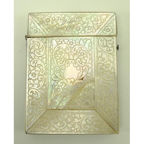 748 - A mother of pearl card case, 19th century, the central section carved with a raised spray of flowers... 