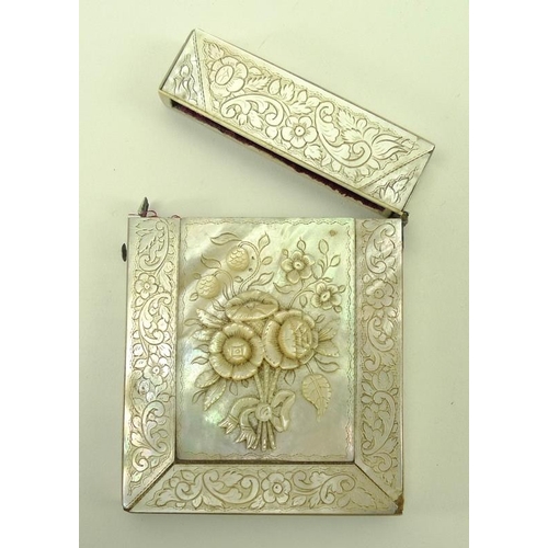 748 - A mother of pearl card case, 19th century, the central section carved with a raised spray of flowers... 