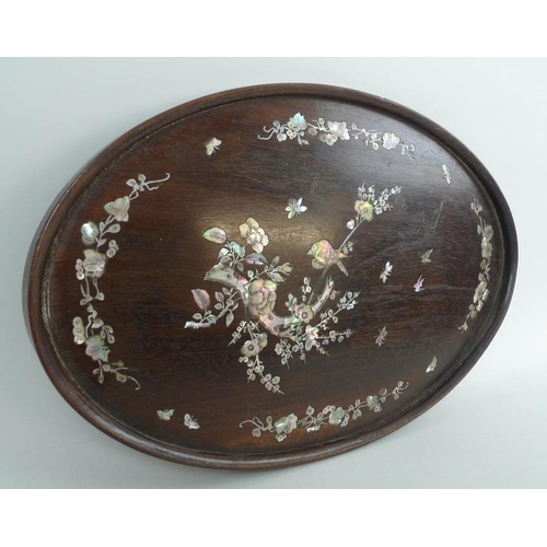 757 - A Japanese wooden oval tray, early 20th century, inlaid with birds and butterflies in mother of pear... 