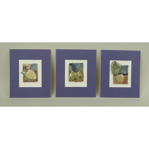 771 - A group of three ceramic plaques, cast and hand painted as an apple, a turnip and onions, handmade b... 