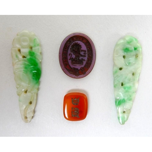 772 - A pair of jade carved and pierced drops, a/f one broken, together with an unmounted intaglio with co... 