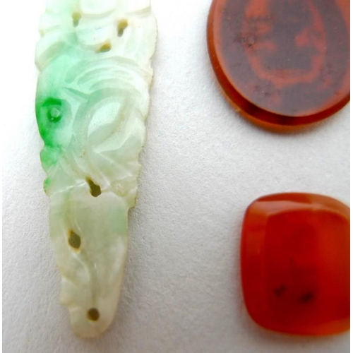 772 - A pair of jade carved and pierced drops, a/f one broken, together with an unmounted intaglio with co... 