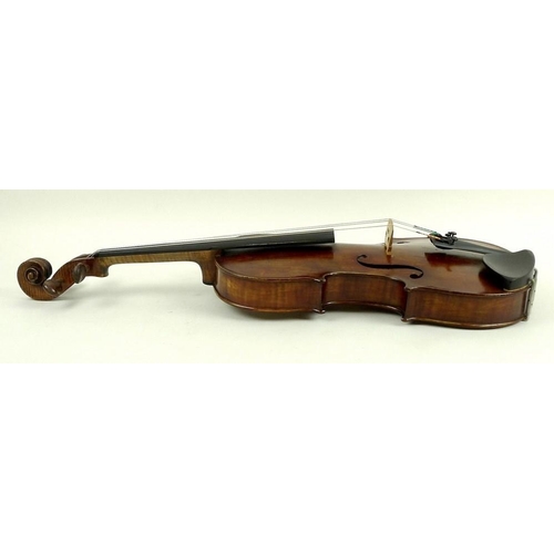 779 - A late 19th century violin, possibly French, with later bridge, tail piece and sound post, label ins... 