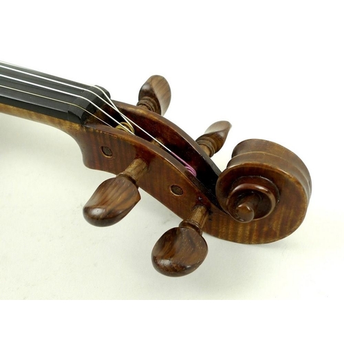 779 - A late 19th century violin, possibly French, with later bridge, tail piece and sound post, label ins... 