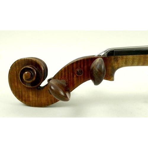 779 - A late 19th century violin, possibly French, with later bridge, tail piece and sound post, label ins... 