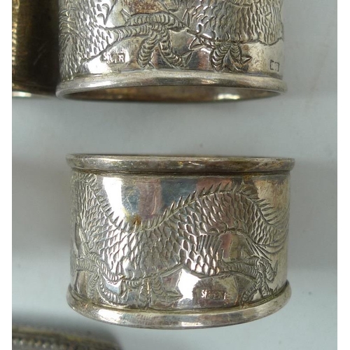 784 - A group of Chinese white metal wares including six napkin rings, a butter dish and cover, decorated ... 