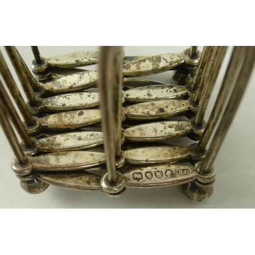 786 - A silver concertina travelling toast rack resembling a series of Gothic windows, London 1885, Edward... 