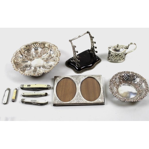 791 - A group of silver items, comprising a photograph frame with two oval sections, a bon-bon dish, a sma... 