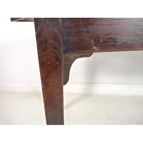 959 - An early 19th century oak table, possibly French, with three plank rectangular surface with rounded ... 