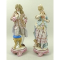 A pair of  KPM figurines, late 19th century, on modelled as a lady with cupid at her feet, the other... 