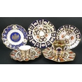A group of Royal Crown Derby plates, comprising a fluted plate in the Old Imari pattern 1128, dated ... 