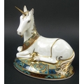 A Royal Crown Derby paperweight, Unicorn, printed mark, gold stopper, limited edition 1337/200, with... 
