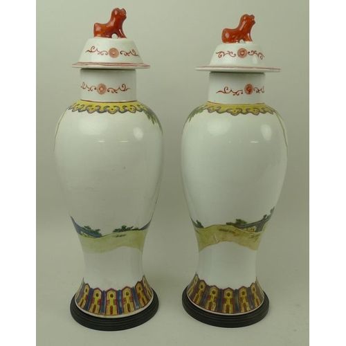 534 - A pair of modern Chinese vases, the bodies decorated with girls strolling arm in arm near a young bo... 