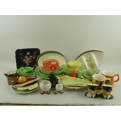 538 - A collection of Carlton Ware, to include a cat money box, a black spill vase, two walking egg cups, ... 