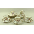 A Dresden part tea set, comprising six cups, six saucers and six small plates, all gilded and painte... 