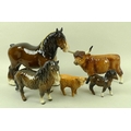 A group of Beswick porcelain farm animal figures, comprising a shire horse, two Shetland ponies and ... 