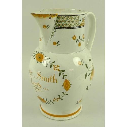 561 - An English pottery creamware jug, late 18th century, of baluster form, sparrow beak spout and strap ... 