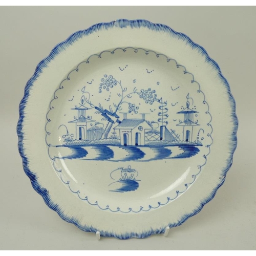 562 - A Liverpool stoneware plate, 18th century, decorated in underglaze blue in the Chinese style with th... 