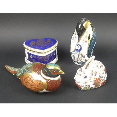 565 - A group of Royal Crown Derby ceramics, comprising three paperweights, Penguin Chick, Meadow Rabbit, ... 