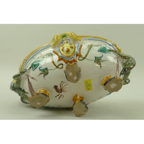 568 - A faience Cantagalli majolica centrepiece, Italian, with salamander handles, raised on four lions pa... 