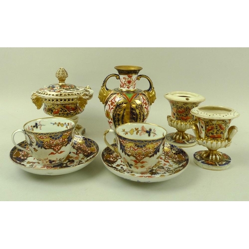 569 - A pair of early 19th century Derby porcelain cups and saucers, decorated in the Imari pattern, one s... 