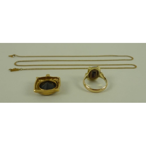 806 - A group of 14ct gold jewellery, comprising a garnet set dress ring, size M, a garnet set pendant and... 