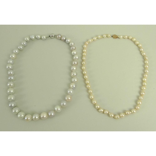 807 - A single strand of forty eight bell and pear shaped pearls set with a 14ct gold clasp stamped with a... 